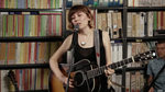 Molly Tuttle_studio_main performing with Copperpeace Glovely Silver Sequined Black Leather Guitar Strap — Red Pocket Version