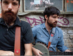 The Avett Brothers wearing Copperpeace Homerun Guitar Strap Brown Leather – Red Embossed Pocket Version